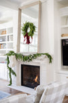 Natural Touch Norfolk Pine Garland, 60" and wreath above fireplace mantel